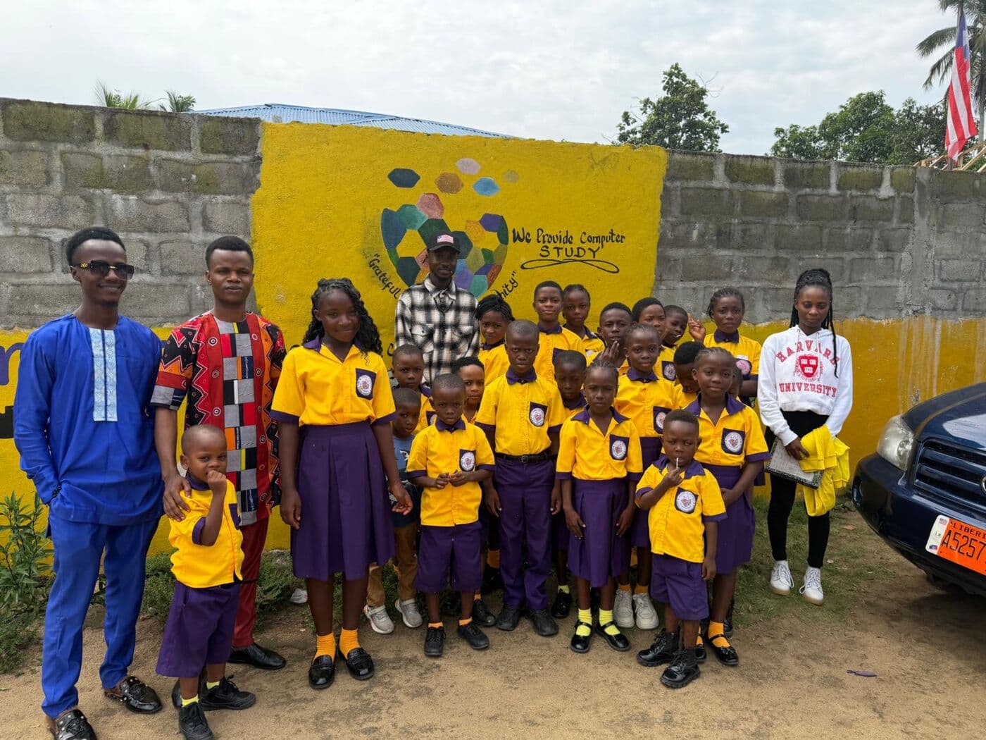 Students from Heart In Heaven Digital Academy outside their school, supported by Heart Partners
