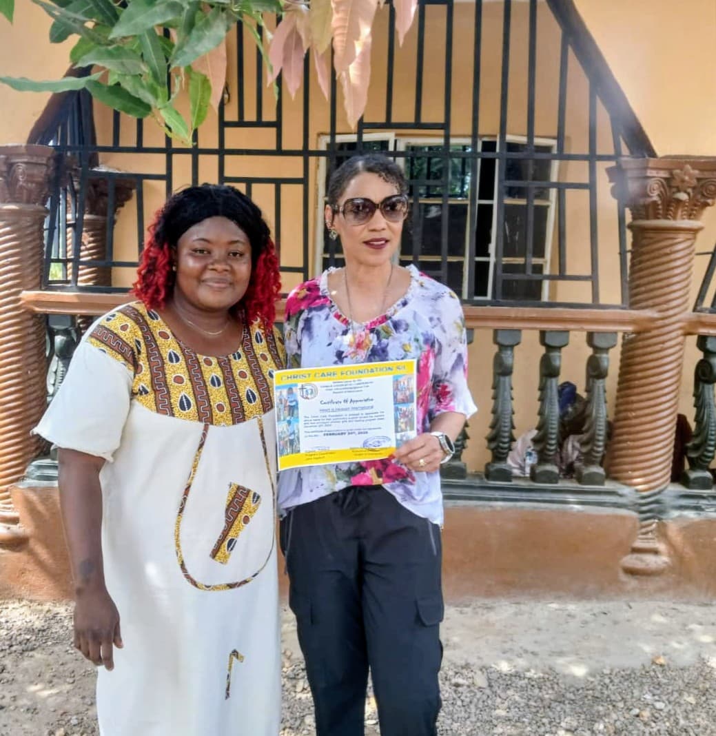Heart In Heaven's founder with CCF founder/director Abigail M. Kamanda holding CCF's Certificate of Appreciation to Heart In Heaven