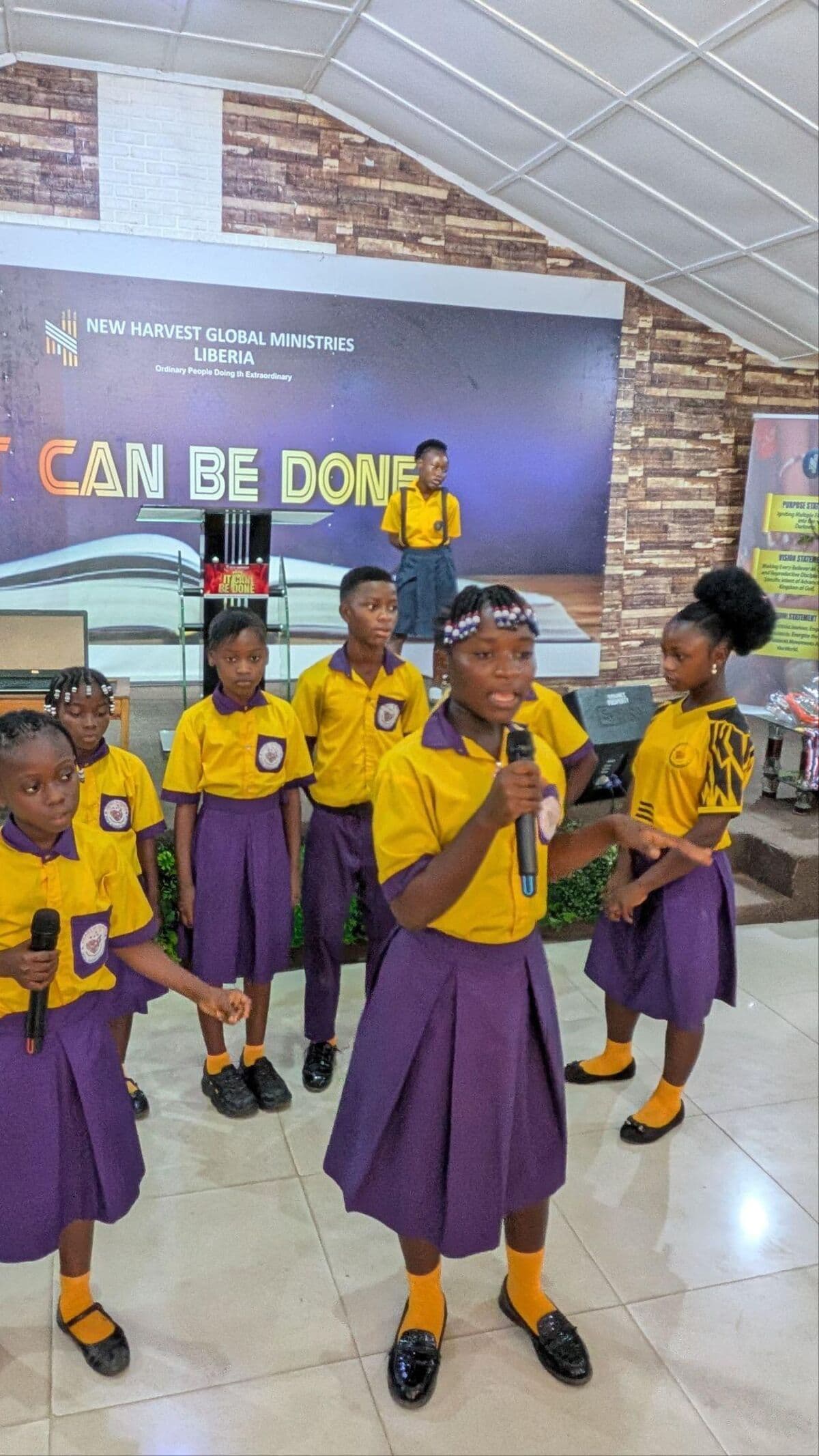 Champion Academy students presenting on stage