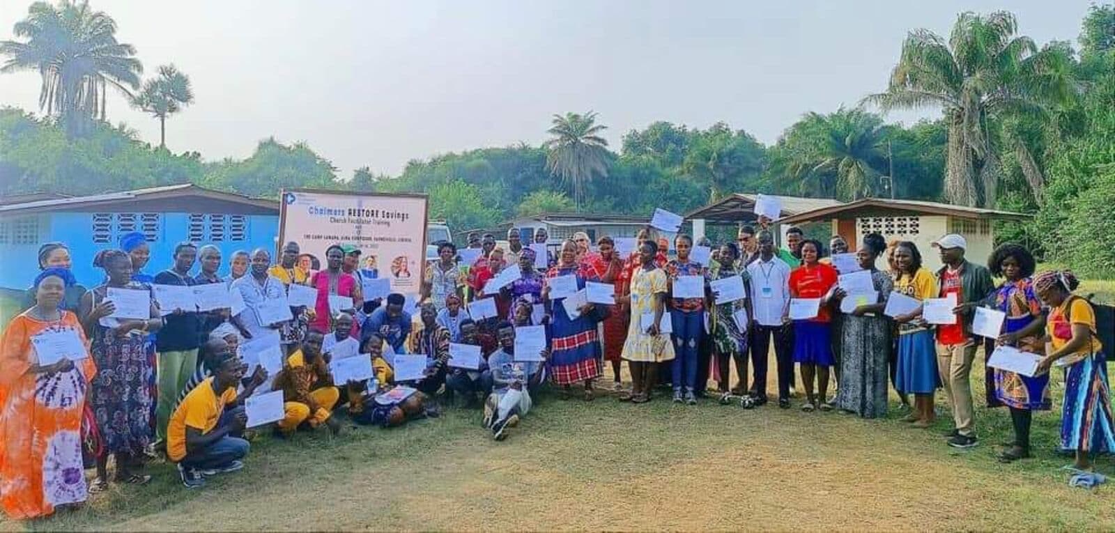 Trained savings group facilitators with their certificates in Paynesville