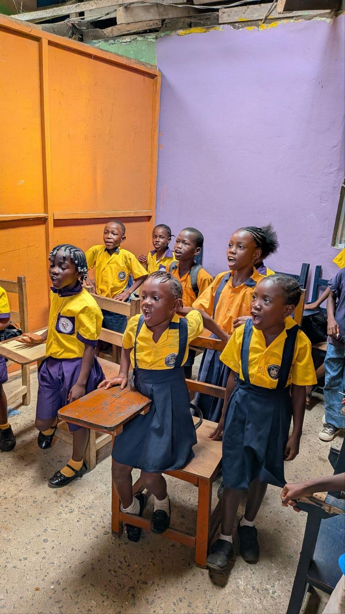Young students in their classroom at Champion Academy